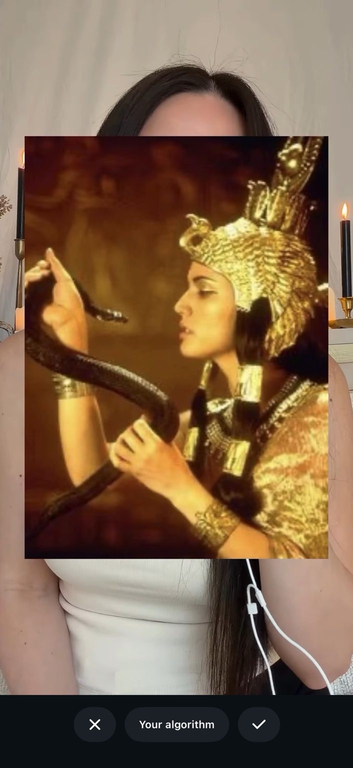 Cleopatra holding a serpent